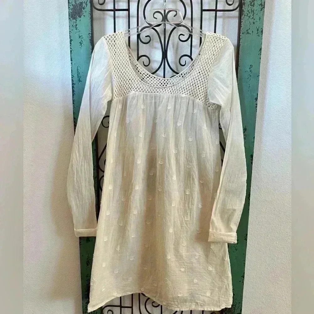 Delicate vintage cotton dress with crochet detailing around neckline.